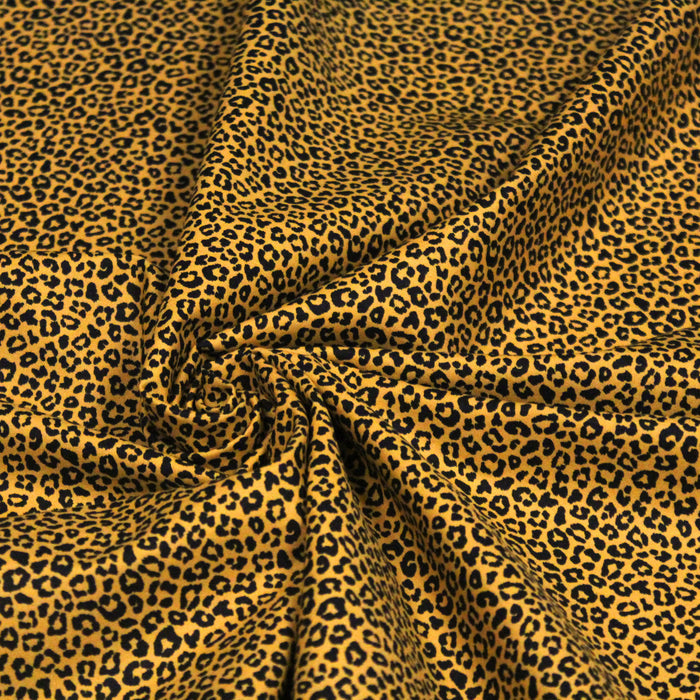 Tissu popeline de coton aux motifs léopard noir sur fond jaune - COLLECTION LEOPARD - OEKO-TEX