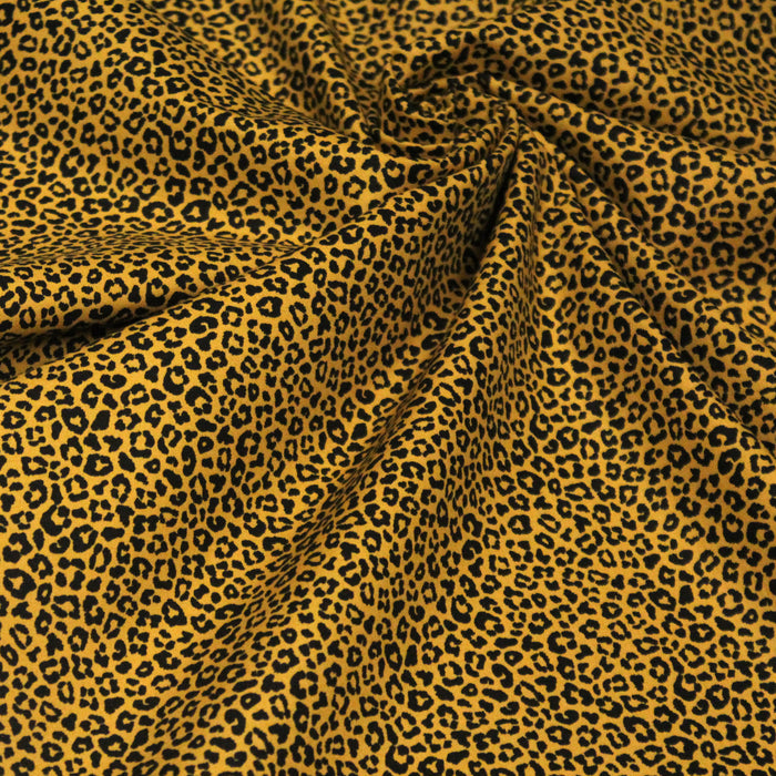 Tissu popeline de coton aux motifs léopard noir sur fond jaune - COLLECTION LEOPARD - OEKO-TEX