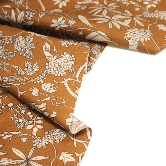 Tissu popeline de coton ocre aux fines fleurs et feuilles écrues - COLLECTION FLORALE