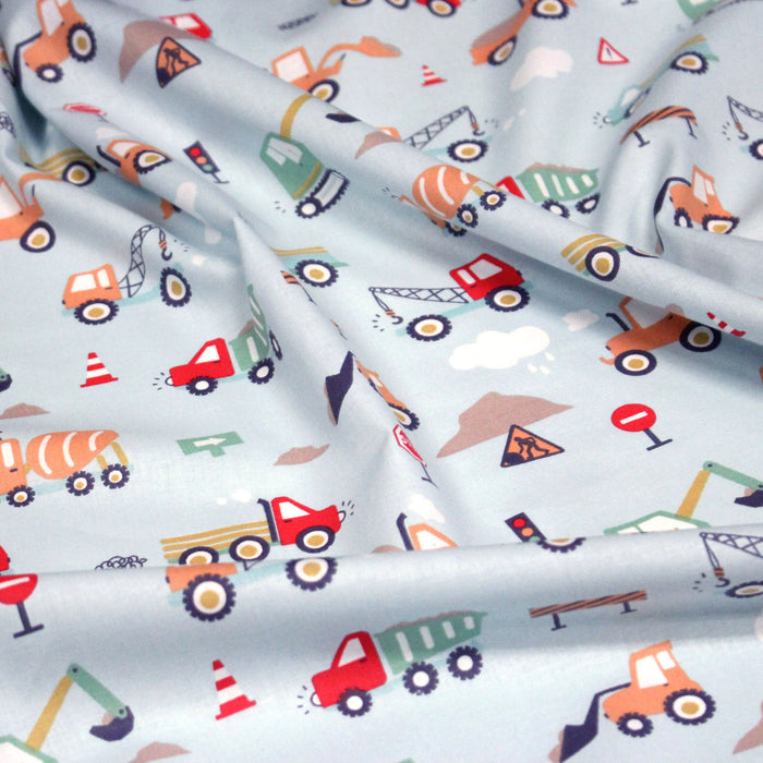 Tissu cotonnade enfant bleu aux grues, camions et tracteurs - STANDARD 100 OEKO-TEX
