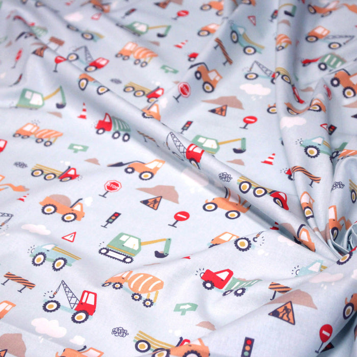 Tissu cotonnade enfant bleu aux grues, camions et tracteurs - STANDARD 100 OEKO-TEX