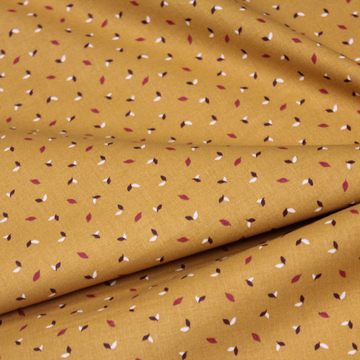 Tissu de coton safran aux petites plumes blanches et rouge tomette - OEKO-TEX®