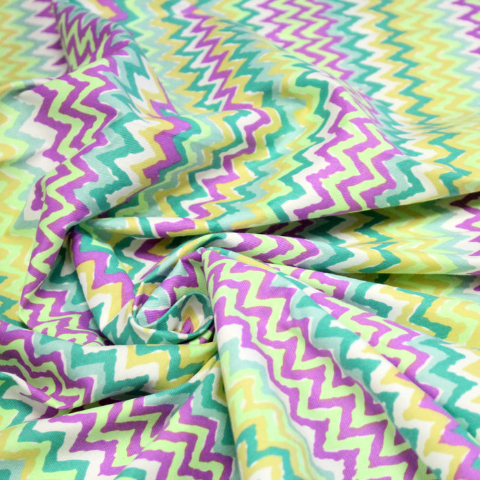 Tissu gabardine coton imprimé motif géométrique ZIG ZAG vert fluo blanc jaune mauve
