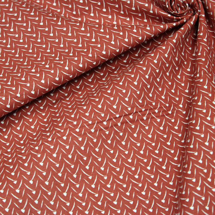 Tissu de coton aux motifs graphiques blancs, fond rouge tomette - OEKO-TEX®