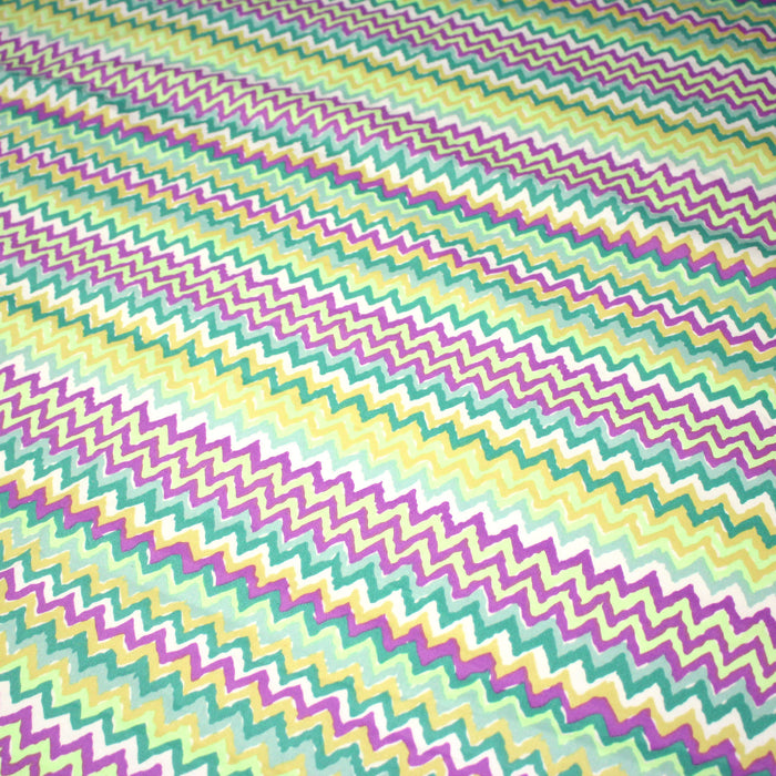 Tissu gabardine coton imprimé motif géométrique ZIG ZAG vert fluo blanc jaune mauve