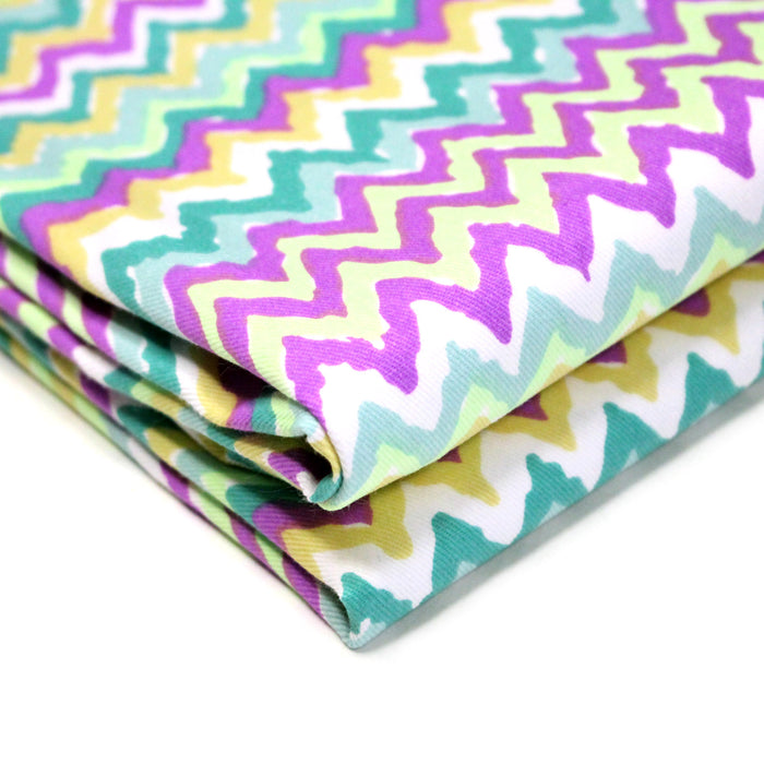 Tissu gabardine coton imprimé motif géométrique ZIG ZAG vert fluo blanc jaune mauve