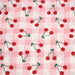 Tissu cotonnade Vichy rose et blanc aux cerises rouges - COLLECTION ÉTÉ - TissusPapi.com