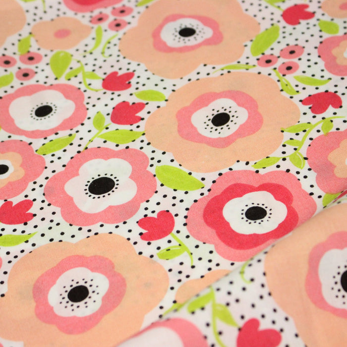 Tissu cotonnade aux belles fleurs roses graphiques sur fond blanc pois noirs - COLLECTION ÉTÉ - TissusPapi.com