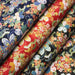 Tissu cotonnade motif japonais traditionnels : fleuris multicolores, fond noir / bleu / rouge - COLLECTION JAPON DORÉ - TissusPapi.com
