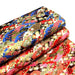 Tissu cotonnade motif japonais traditionnels : fleurs de cerisier, nuages et motifs géométriques dorés, fond bleu / rouge - COLLECTION JAPON DORÉ - TissusPapi.com