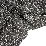 Tissu cotonnade noir aux fleurs blanches - OEKO - TEX - TissusPapi.com