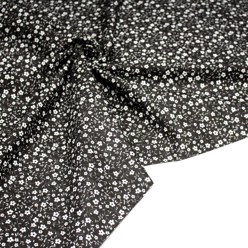 Tissu cotonnade noir aux fleurs blanches - OEKO - TEX - TissusPapi.com