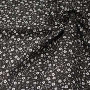 Tissu cotonnade noir aux fleurs blanches - OEKO - TEX - TissusPapi.com