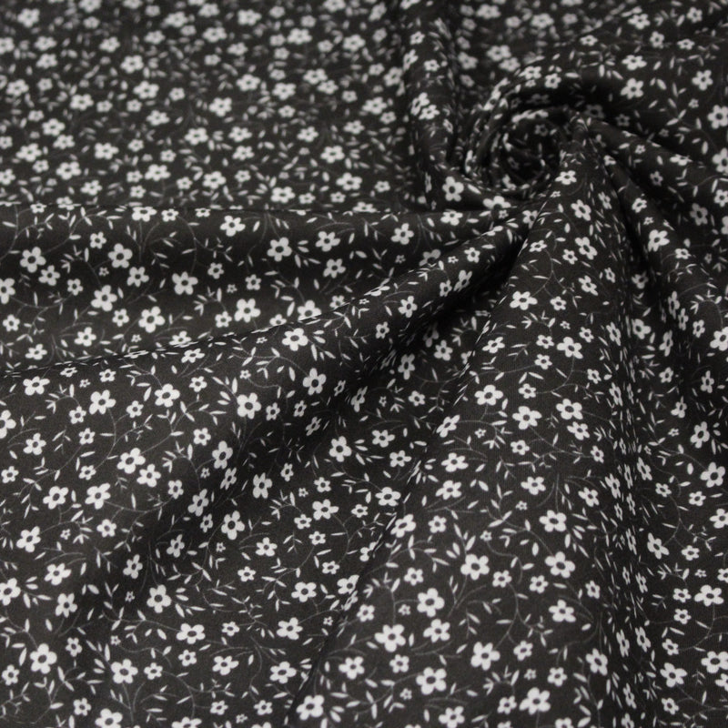 Tissu cotonnade noir aux fleurs blanches - OEKO - TEX - TissusPapi.com