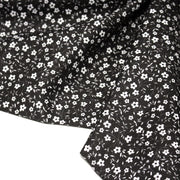 Tissu cotonnade noir aux fleurs blanches - OEKO - TEX - TissusPapi.com