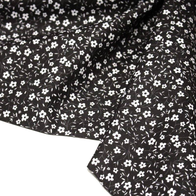 Tissu cotonnade noir aux fleurs blanches - OEKO - TEX - TissusPapi.com