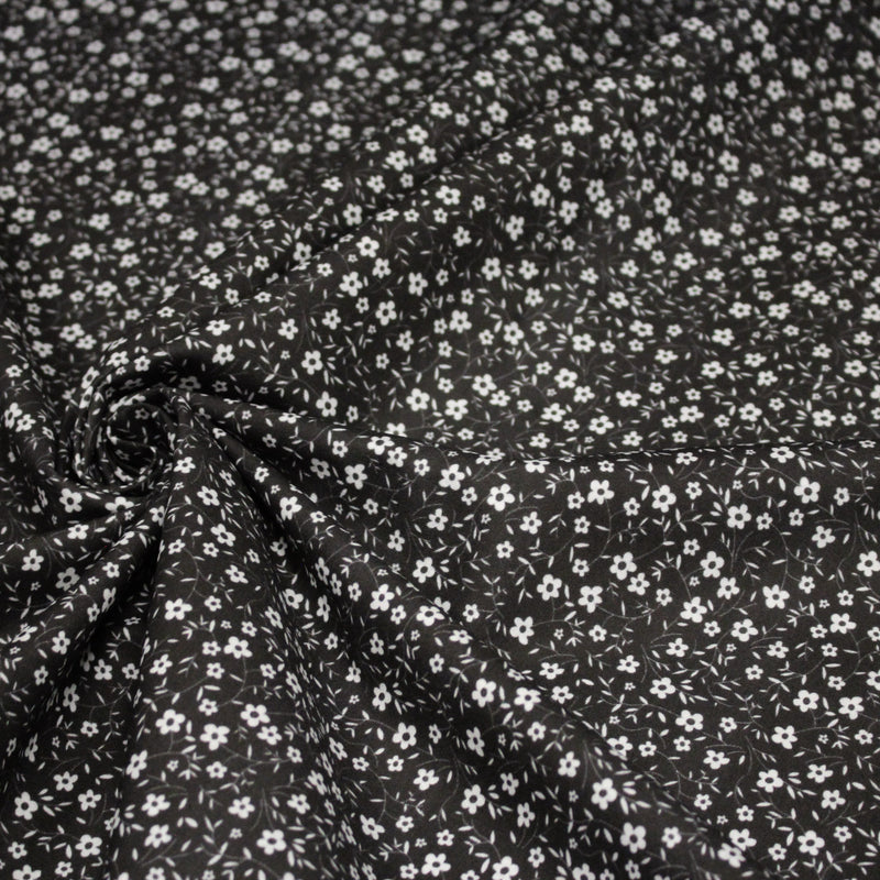 Tissu cotonnade noir aux fleurs blanches - OEKO - TEX - TissusPapi.com