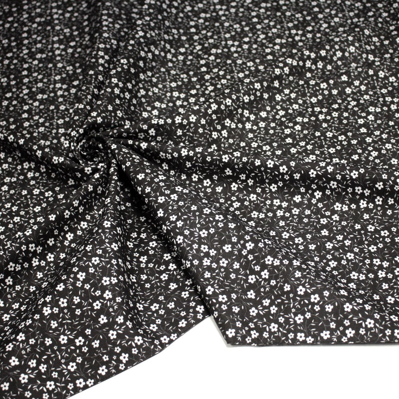 Tissu cotonnade noir aux fleurs blanches - OEKO - TEX - TissusPapi.com