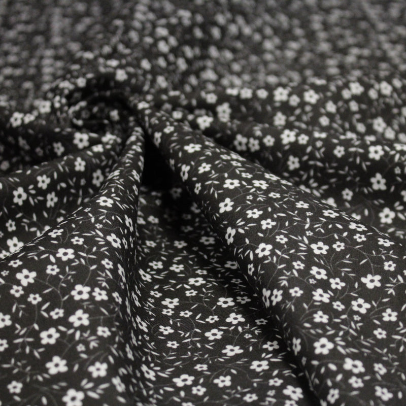 Tissu cotonnade noir aux fleurs blanches - OEKO - TEX - TissusPapi.com