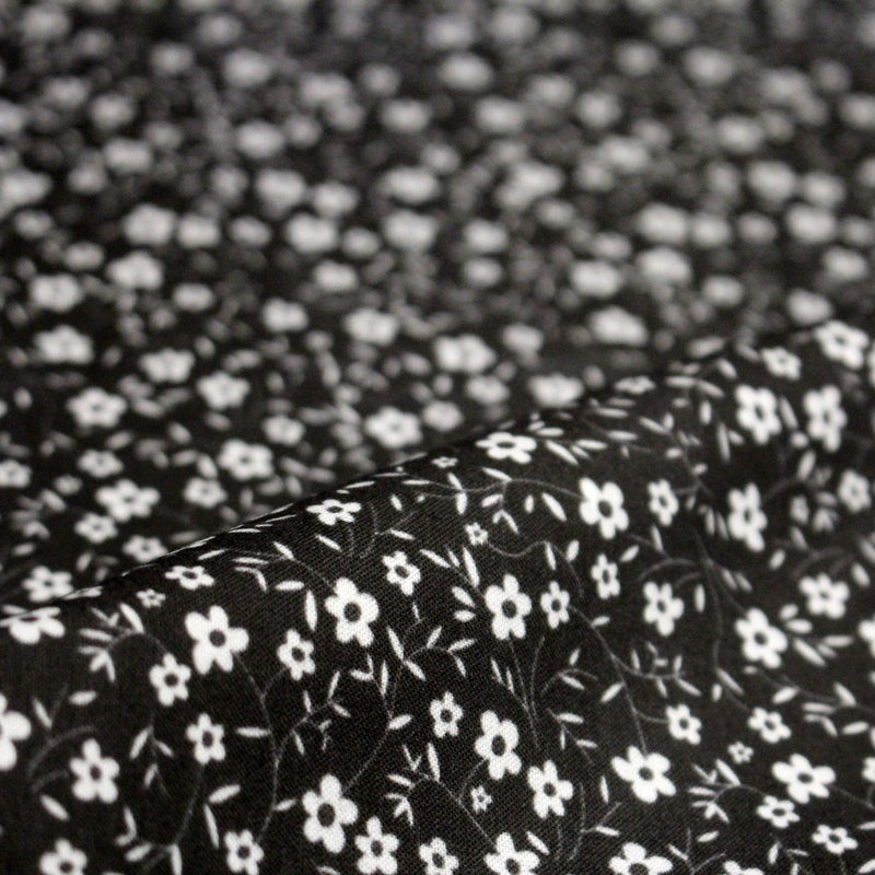 Tissu cotonnade noir aux fleurs blanches - OEKO - TEX - TissusPapi.com