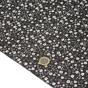 Tissu cotonnade noir aux fleurs blanches - OEKO - TEX - TissusPapi.com