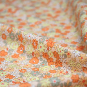 Tissu popeline coton fleurie orange jaune vert fond orange - OEKO - TEX - TissusPapi.com