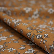 Tissu popeline coton ocre aux fines fleurs écrues & noires - OEKO - TEX - TissusPapi.com