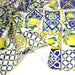 Tissu gabardine coton imprimée motif carreaux de faïence bleus et citrons jaunes - ON DESTOCKE ! - TissusPapi.com
