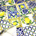 Tissu gabardine coton imprimée motif carreaux de faïence bleus et citrons jaunes - ON DESTOCKE ! - TissusPapi.com