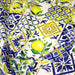 Tissu gabardine coton imprimée motif carreaux de faïence bleus et citrons jaunes - ON DESTOCKE ! - TissusPapi.com