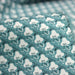 Tissu popeline coton, fleurs stylisées vert céladon et blanc - TissusPapi.com