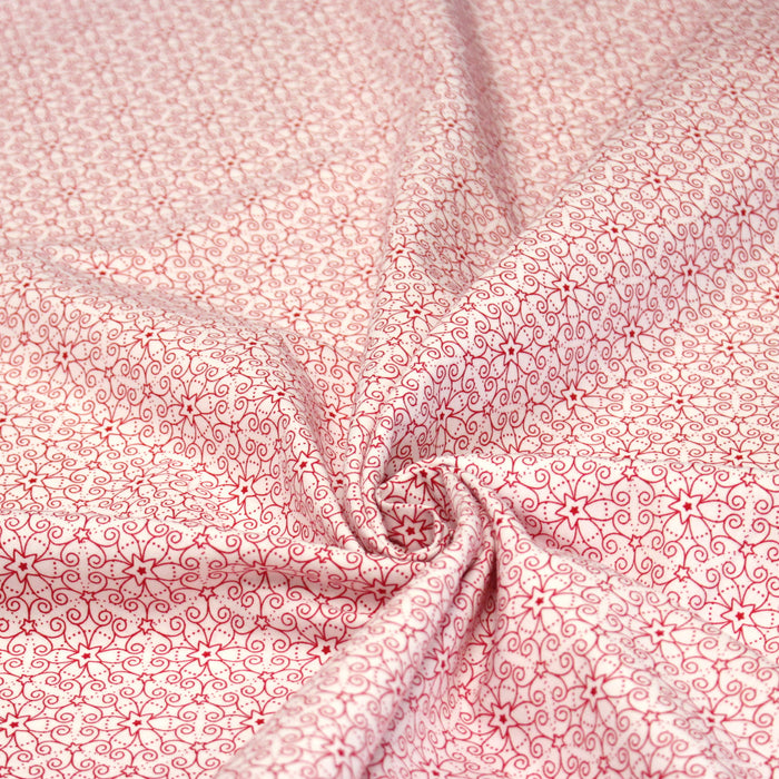 Tissu de Noël cotonnade blanc aux motifs géométriques rouges de Noël