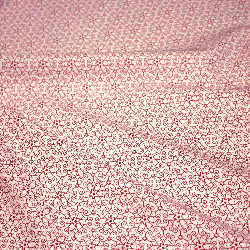 Tissu de Noël cotonnade blanc aux motifs géométriques rouges de Noël - TissusPapi.com