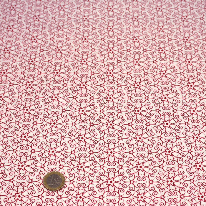 Tissu de Noël cotonnade blanc aux motifs géométriques rouges de Noël