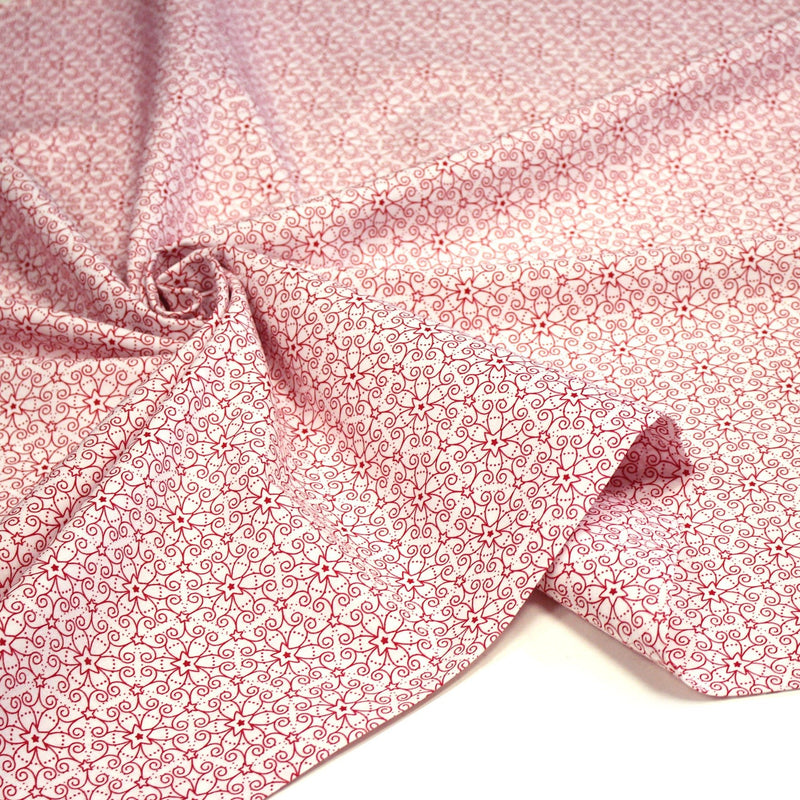 Tissu de Noël cotonnade blanc aux motifs géométriques rouges de Noël - TissusPapi.com