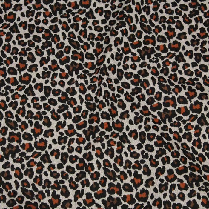 Tissu de coton demi-natté lin motif léopard noir, rouille et marron