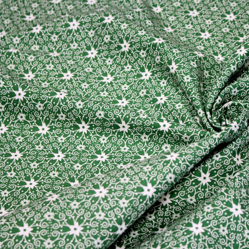 Tissu de Noël cotonnade vert aux motifs géométriques blancs de Noël - TissusPapi.com