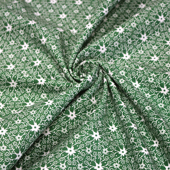 Tissu de Noël cotonnade vert aux motifs géométriques blancs de Noël