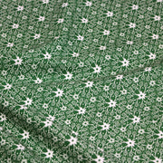 Tissu de Noël cotonnade vert aux motifs géométriques blancs de Noël - TissusPapi.com