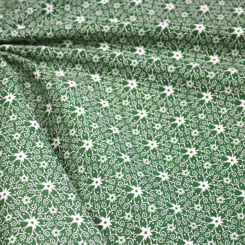 Tissu de Noël cotonnade vert aux motifs géométriques blancs de Noël - TissusPapi.com