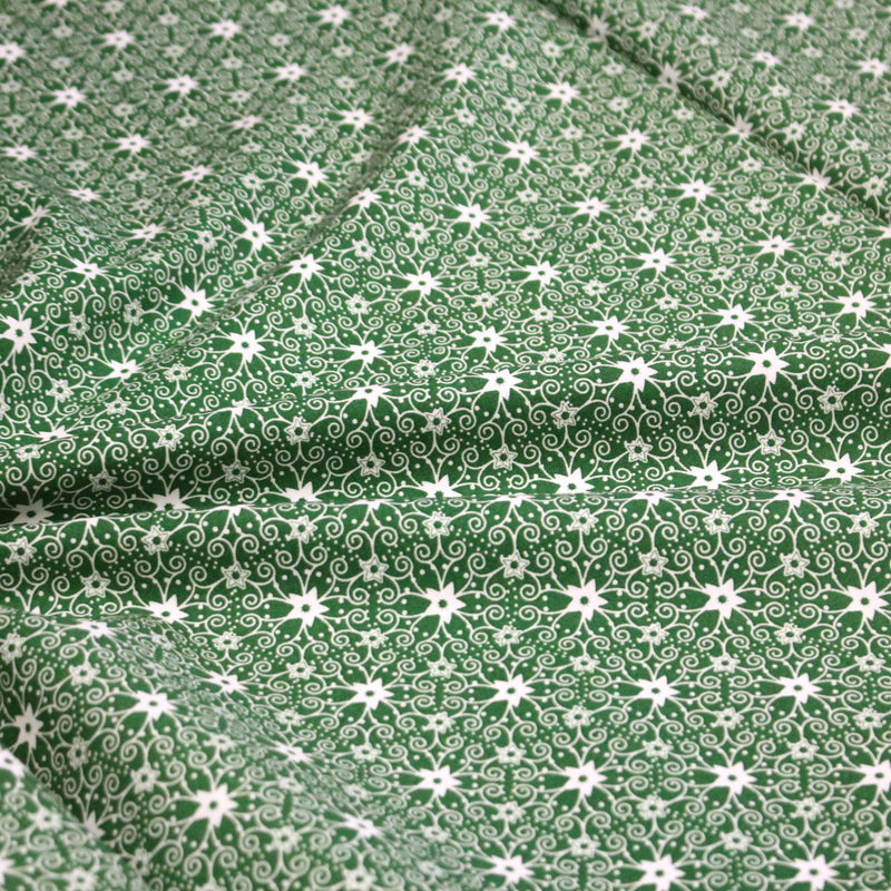 Tissu de Noël cotonnade vert aux motifs géométriques blancs de Noël - TissusPapi.com