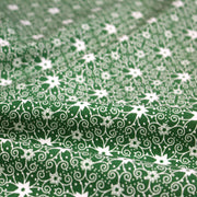 Tissu de Noël cotonnade vert aux motifs géométriques blancs de Noël - TissusPapi.com