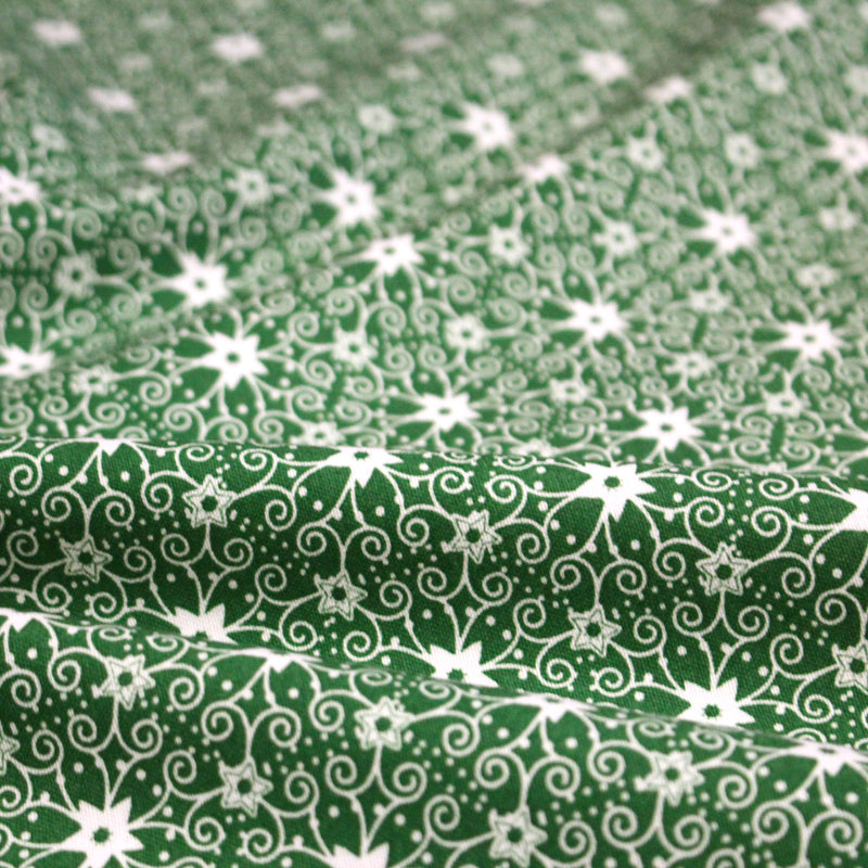 Tissu de Noël cotonnade vert aux motifs géométriques blancs de Noël - TissusPapi.com