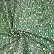 Tissu de Noël cotonnade vert aux motifs géométriques blancs de Noël - TissusPapi.com