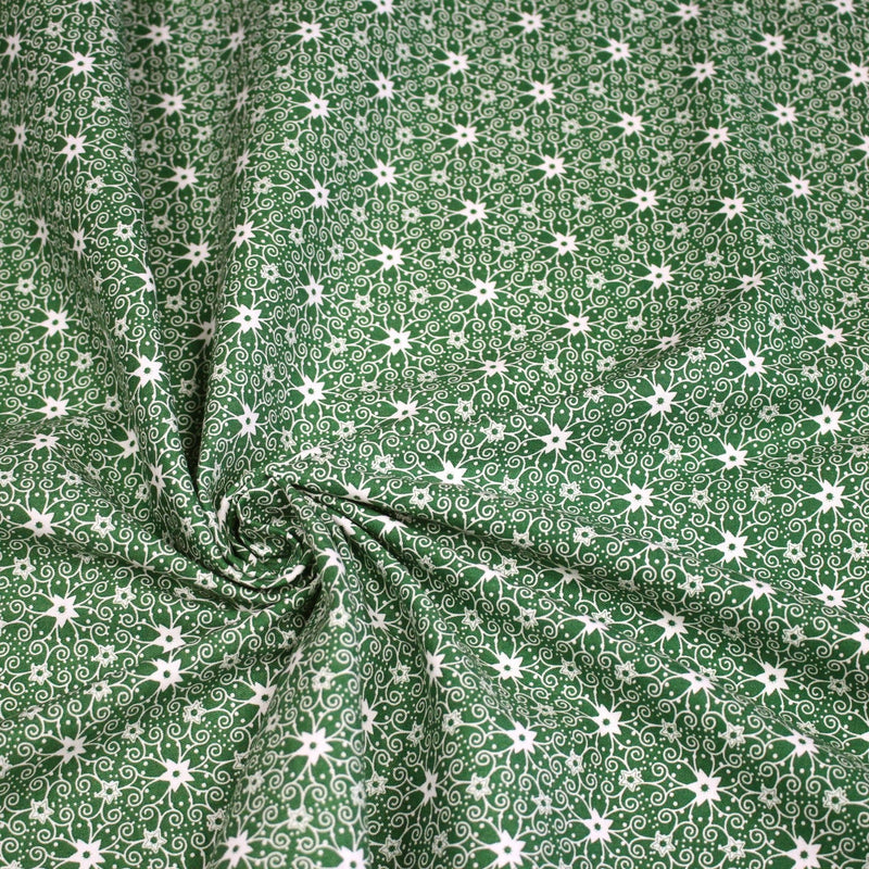 Tissu de Noël cotonnade vert aux motifs géométriques blancs de Noël - TissusPapi.com