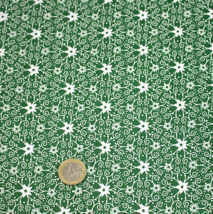 Tissu de Noël cotonnade vert aux motifs géométriques blancs de Noël