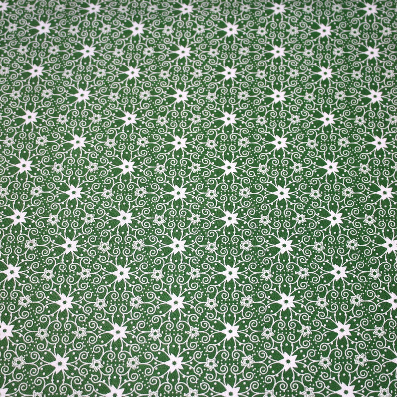 Tissu de Noël cotonnade vert aux motifs géométriques blancs de Noël - TissusPapi.com