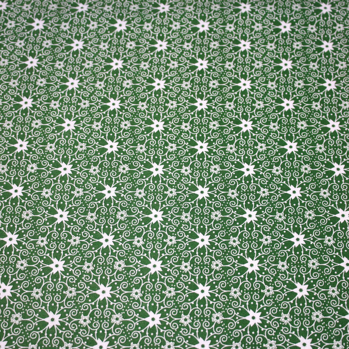 Tissu de Noël cotonnade vert aux motifs géométriques blancs de Noël