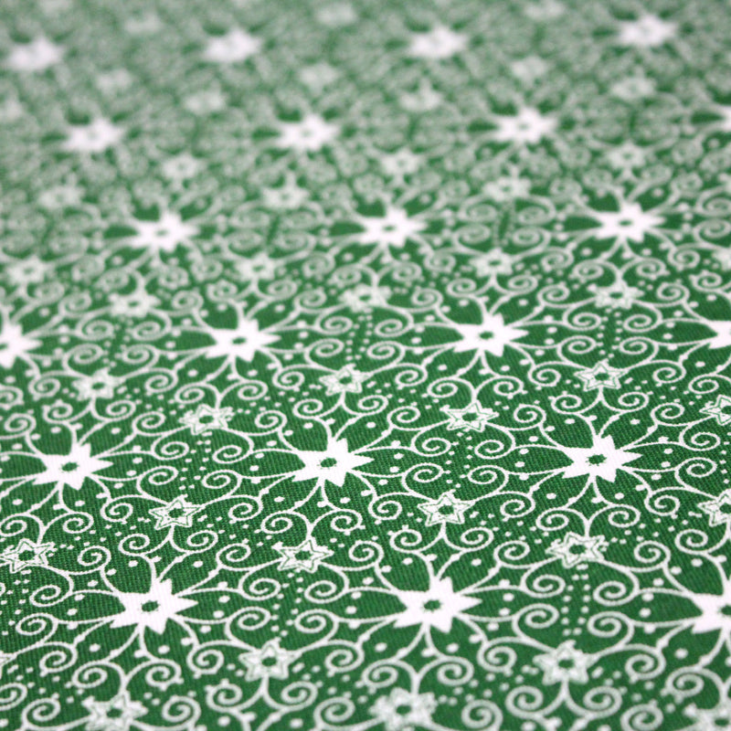 Tissu de Noël cotonnade vert aux motifs géométriques blancs de Noël - TissusPapi.com