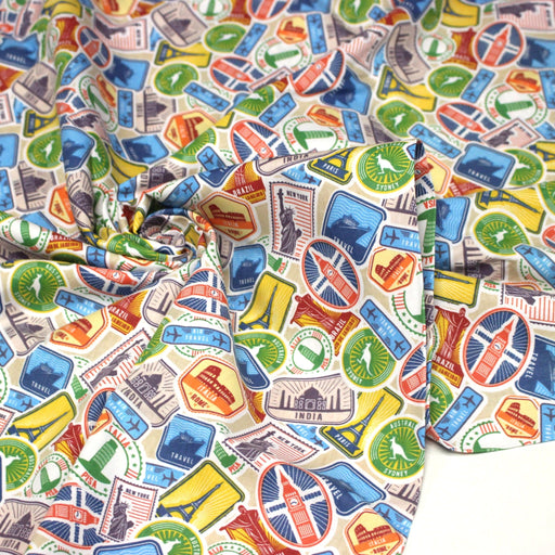 Tissu popeline coton, les autocollants de voyages, tons multicolores - Collection VOYAGE - TissusPapi.com